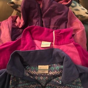 Three girls’ Columbia jackets